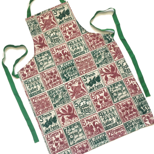 The Twelve days of Christmas organic cotton apron lino cut by Kate Guy